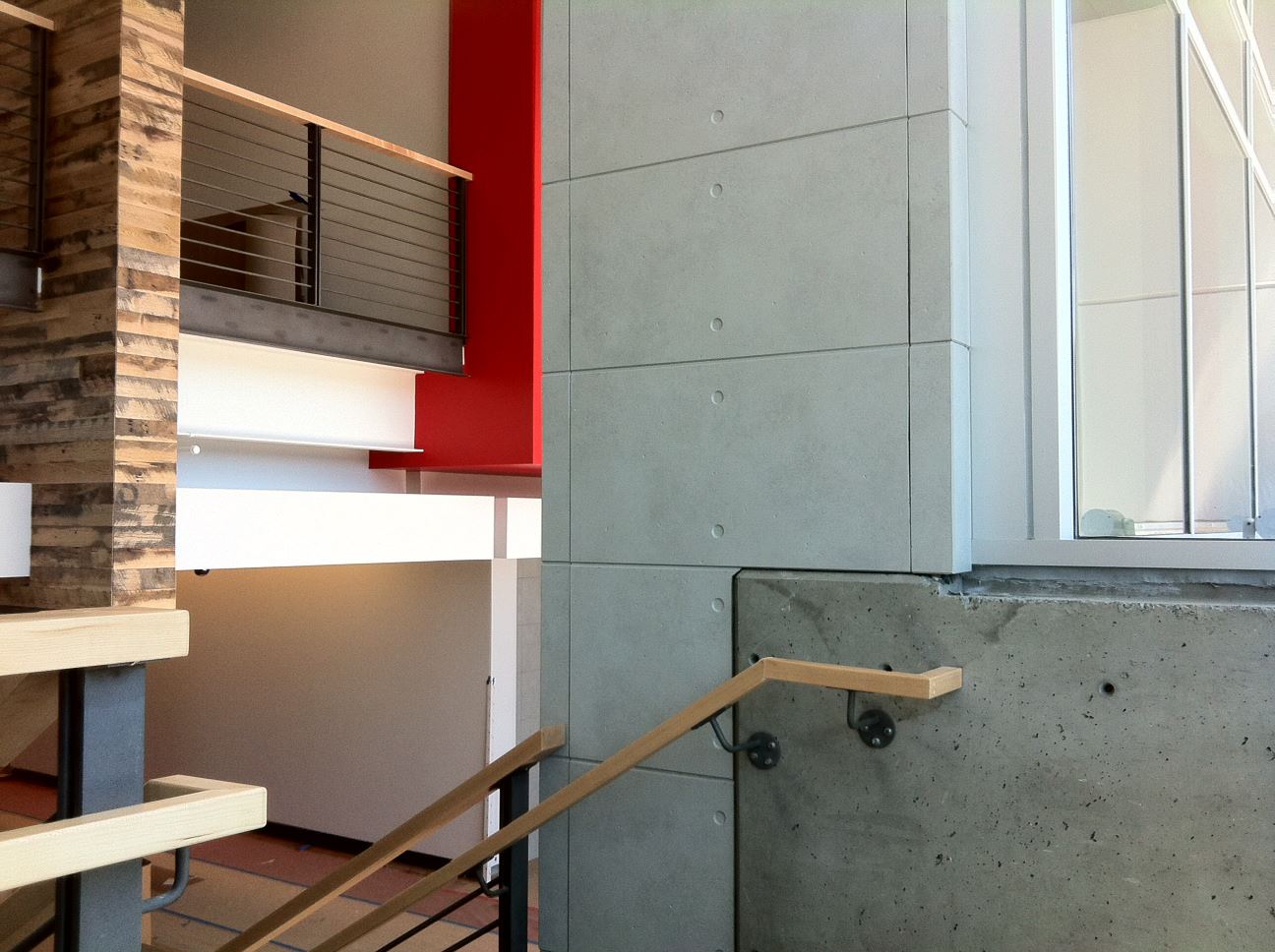 Modern building showcasing fiber cement panels with wood, brick or stone aesthetic