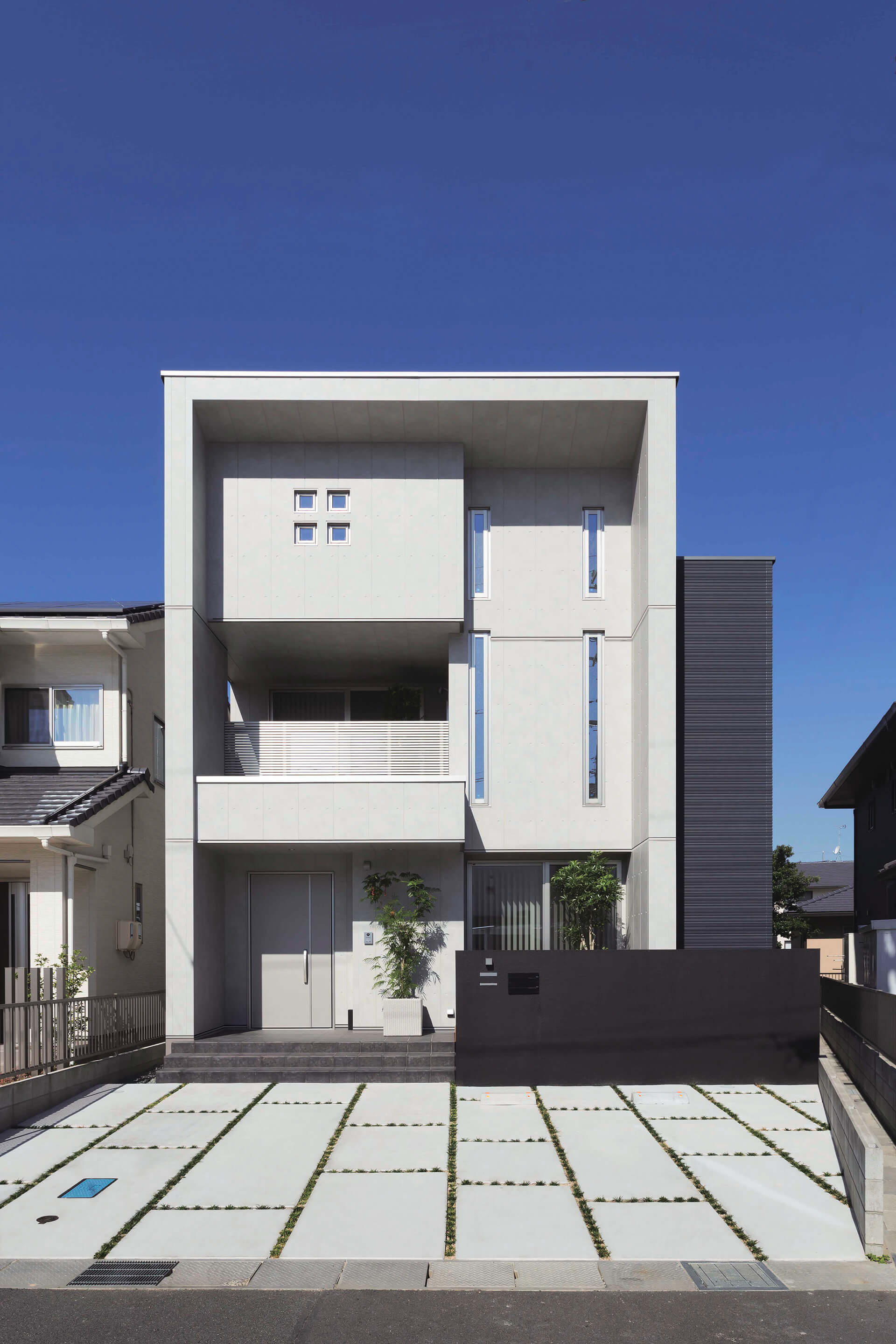Modern residential building with small windows and Nichiha concrete series panel EmpireBlock