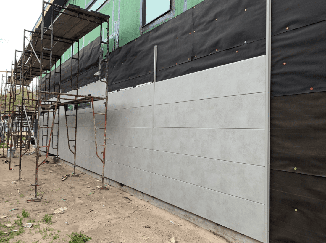 Exterior view of a building featuring Nichiha fiber cement panels and modern design