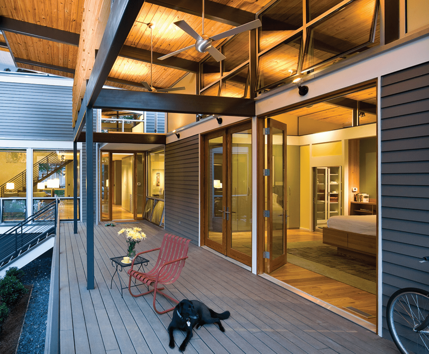 Exterior view of modern residential building with fiber cement panels and large windows