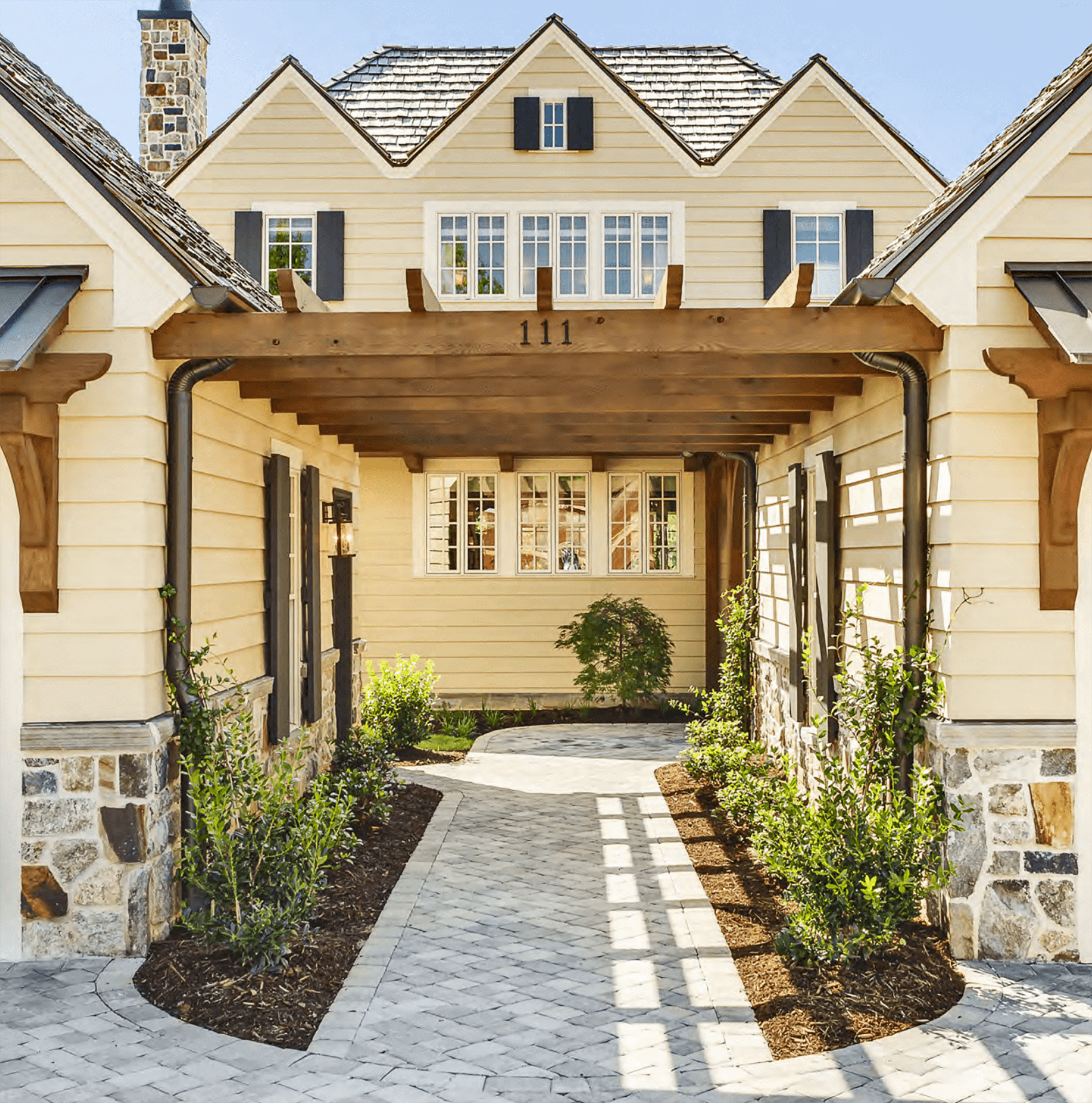 Exterior view of modern residential building with fiber cement panels and large windows