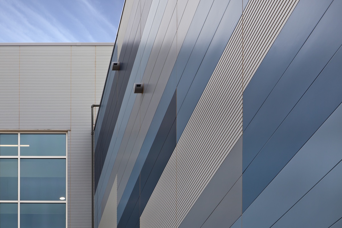 Exterior view of a building featuring Nichiha fiber cement panels and modern design