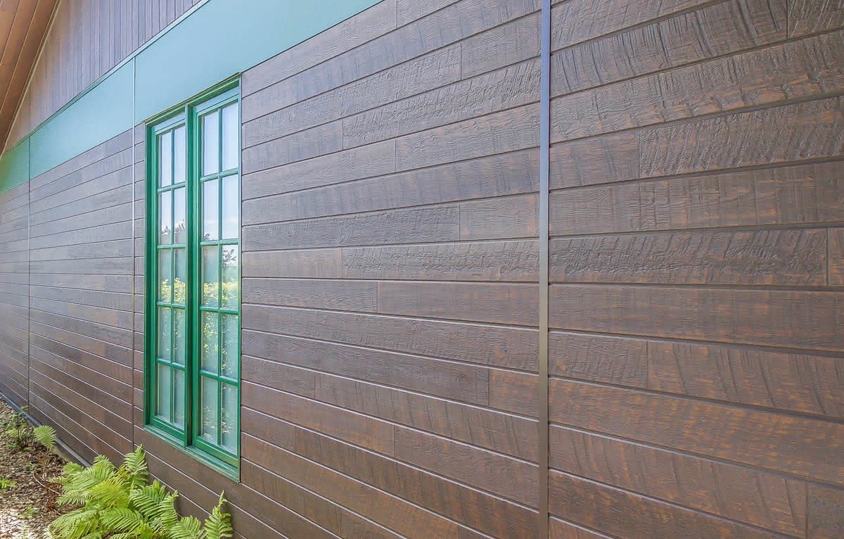 Exterior view of a building featuring Nichiha fiber cement panels and modern design