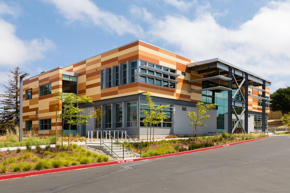 A shot of Hayward High School utilizing Nichiha&rsquo;s Illumination fiber cement cladding in custom shades of orange.