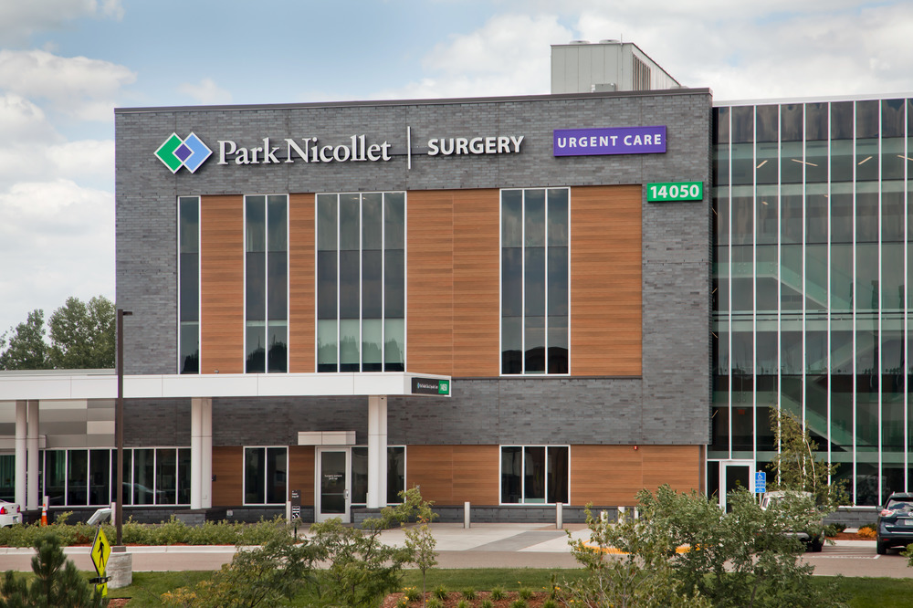 A photo of Park Nicollet health care building decorated in Nichiha&rsquo;s fiber cement cladding from the VintageWood and Illumination series with a plethora of windows present.