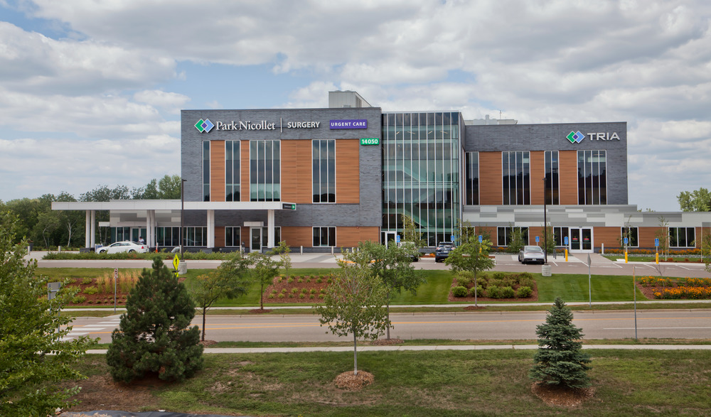 A faraway shot of Park Nicollet Surgery healthcare building decorated with Nichiha&rsquo;s VintageWood and Illumination series fiber cement cladding.
