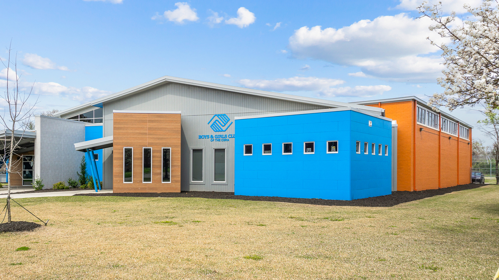 Modern building showcasing fiber cement panels with wood, brick or stone aesthetic
