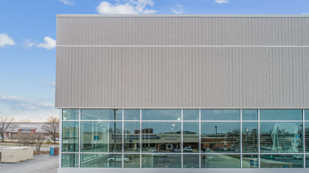 Modern building showcasing fiber cement panels with wood, brick or stone aesthetic