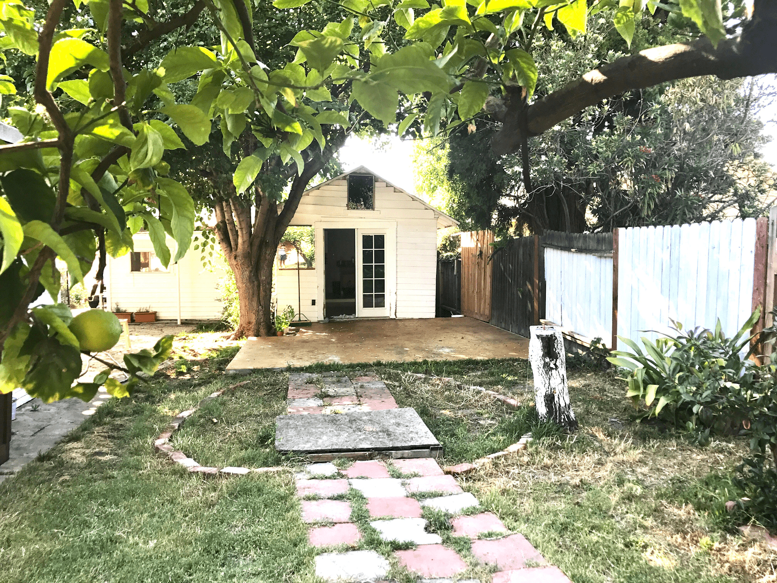 Before image of Rosa’s home’s garage in disrepair