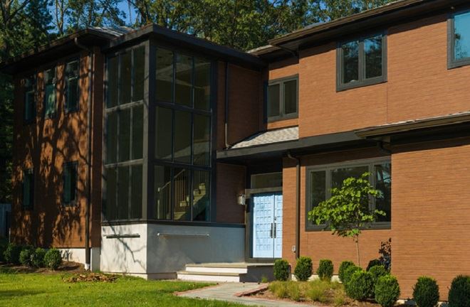 Exterior view of a building featuring Nichiha fiber cement panels and modern design