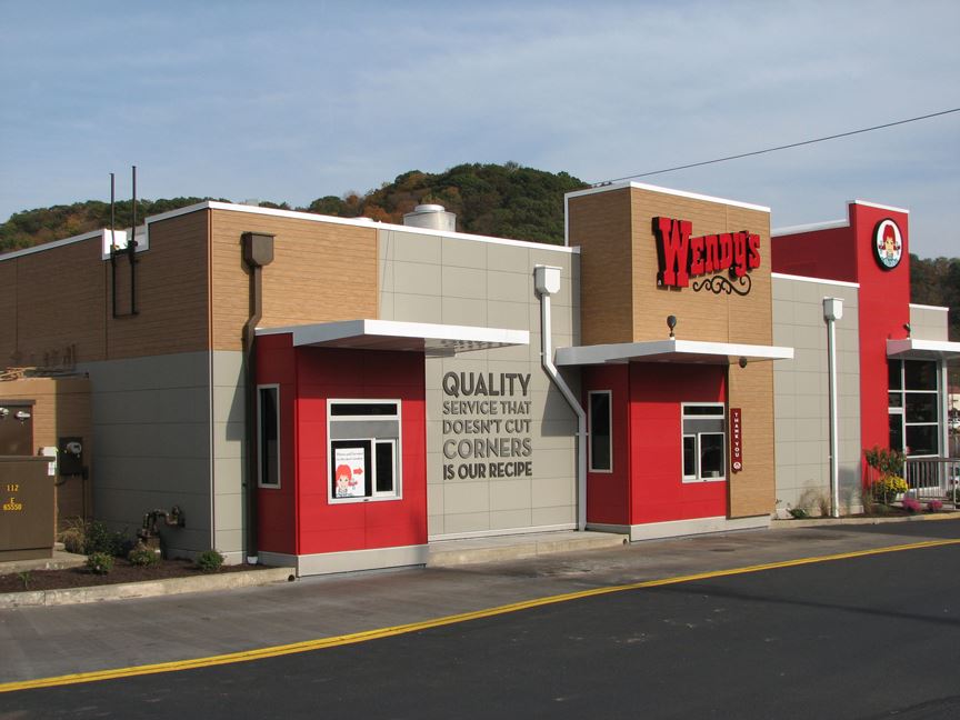 Modern building showcasing fiber cement panels with wood, brick or stone aesthetic