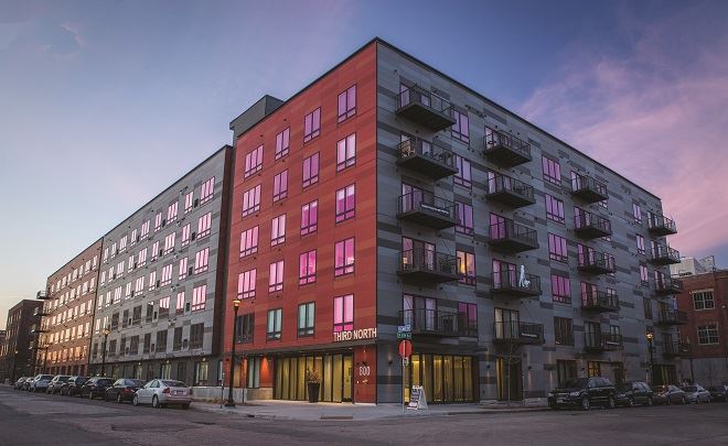 Exterior view of Third North Apartments building featuring fiber cement panels and large windows