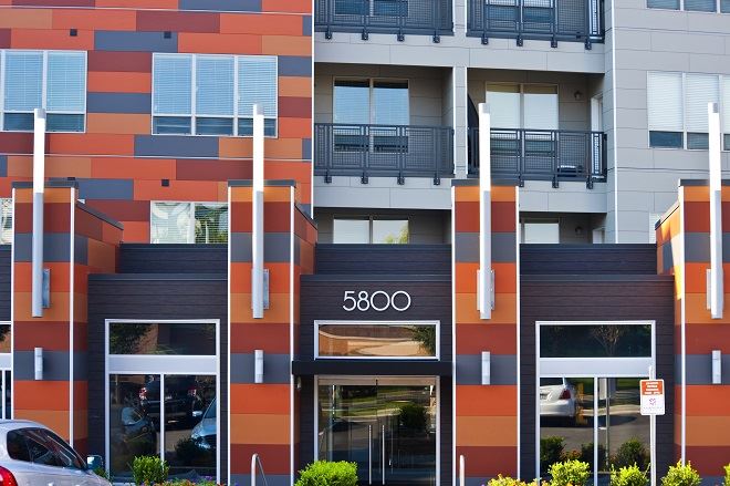 Modern building showcasing fiber cement panels with wood, brick or stone aesthetic