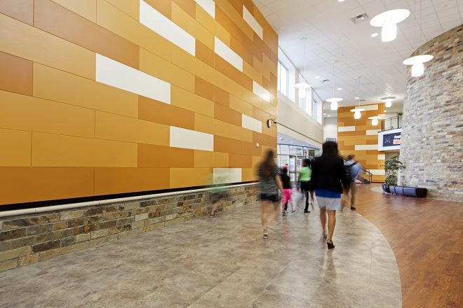 Exterior view of a building featuring Nichiha fiber cement panels and modern design