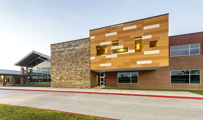 Exterior view of a building featuring Nichiha fiber cement panels and modern design