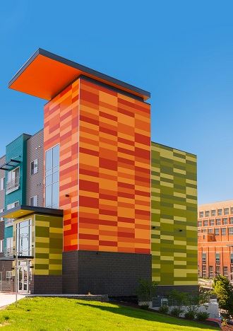 Exterior view of Marketplace Lofts building with fiber cement panels and expansive windows