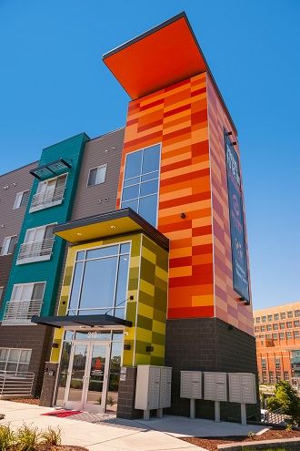 Exterior view of Marketplace Lofts building with fiber cement panels and expansive windows