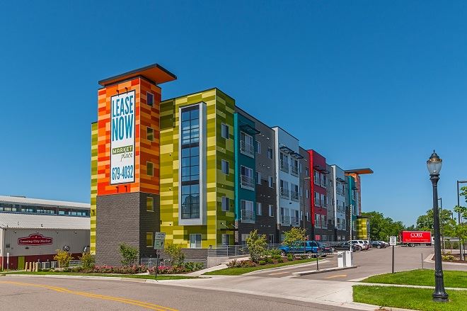 Exterior view of Marketplace Lofts building with fiber cement panels and expansive windows