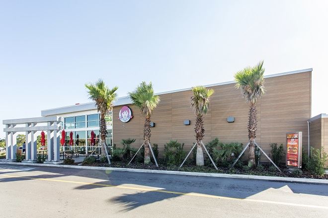 Exterior view of a building featuring Nichiha fiber cement panels and modern design