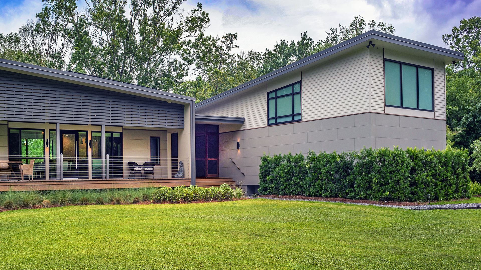 mid century modern home with nichiha siding