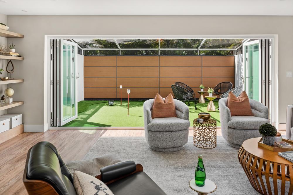 A backyard behind a living room utilizing Nichiha’s RiftSawn cladding.