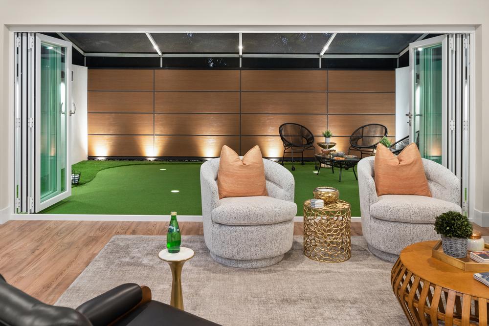 A backyard behind a living room utilizing Nichiha&rsquo;s RiftSawn cladding.