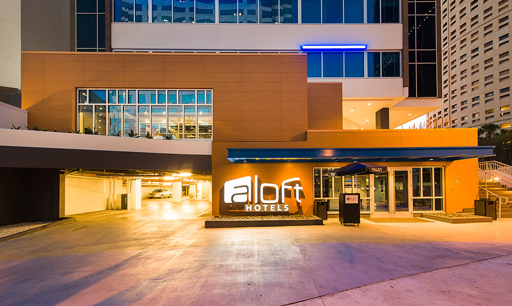 Exterior view of a building featuring Nichiha fiber cement panels and modern design