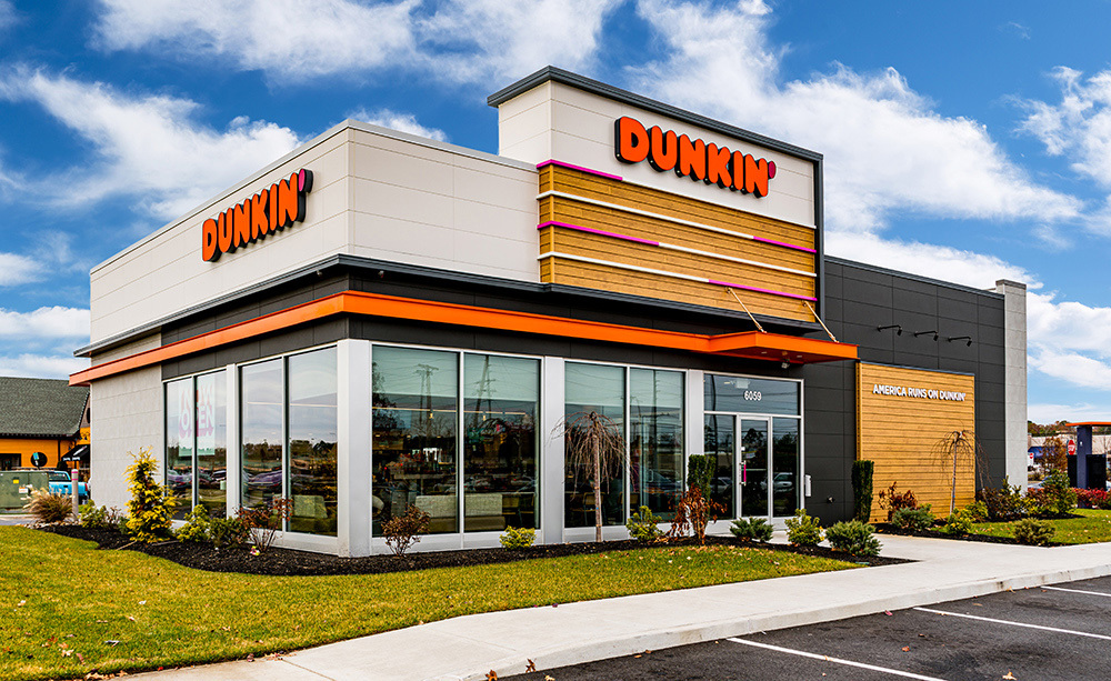 Exterior view of a building featuring Nichiha fiber cement panels and modern design