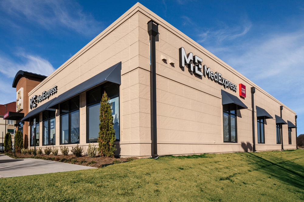Exterior view of a building featuring Nichiha fiber cement panels and modern design