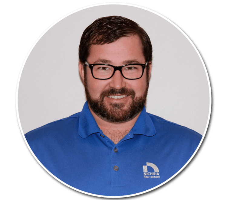 Exterior view of a building featuring Nichiha fiber cement panels and modern design