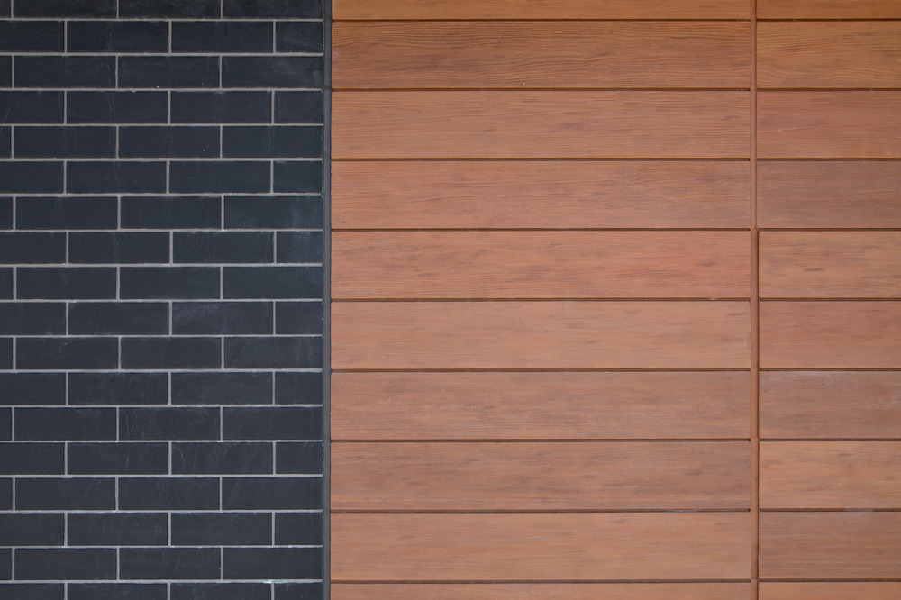 A close-up of Nichiha&rsquo;s ModernBrick and VintageWood fiber cement cladding.
