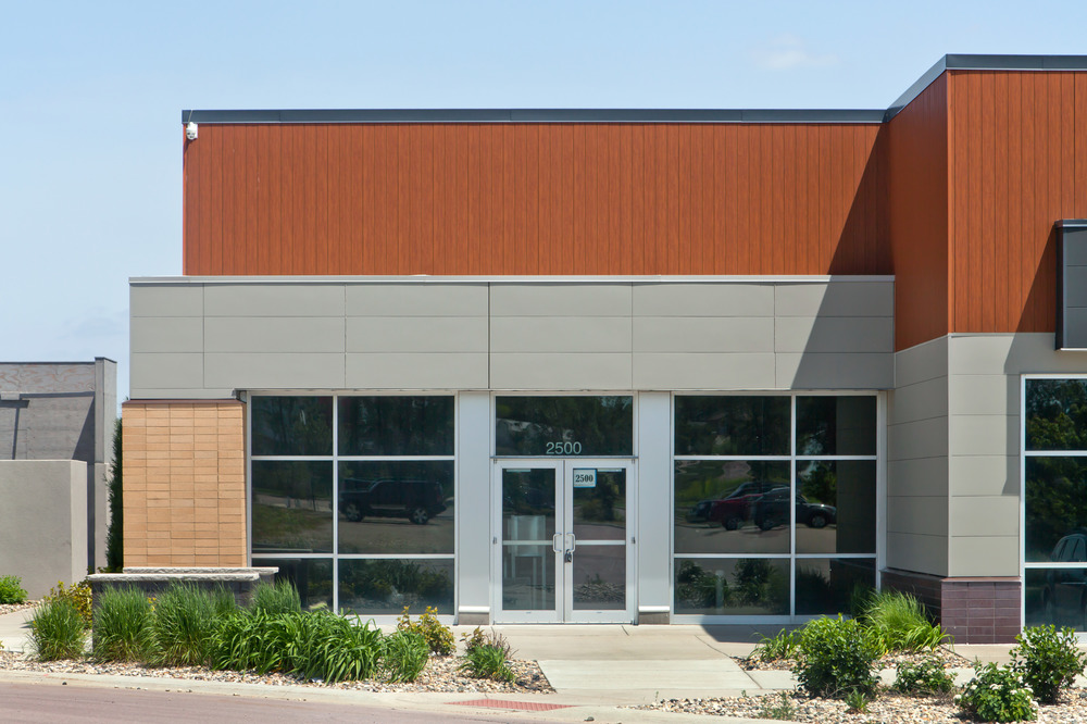 A close-up of South Lorraine Place strip mall utilizing Nichiha&rsquo;s fiber cement cladding.