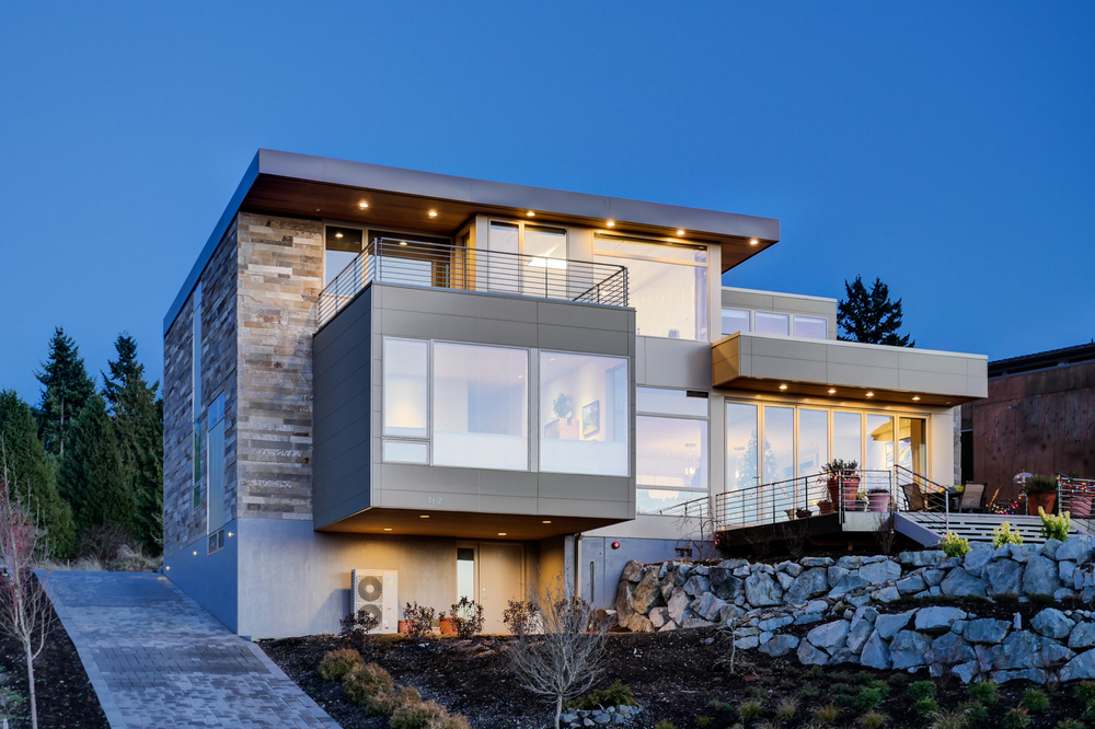A home with brick-aesthetic fiber cement siding from Nichiha at dusk.