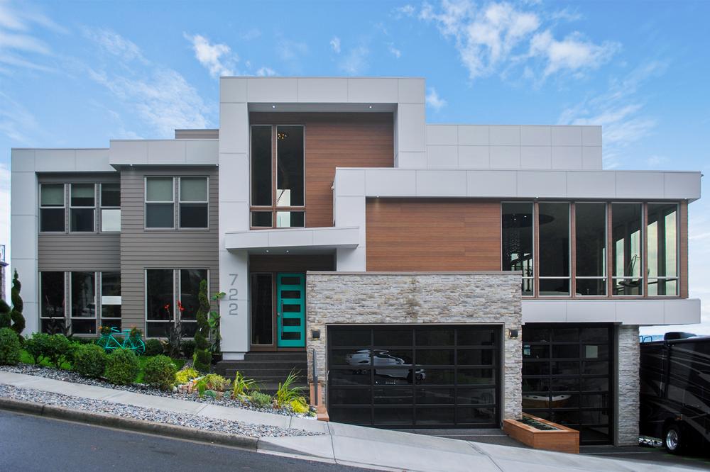  A home with wood-like and brick-like siding on a home utilizing Nichiha&rsquo;s fiber cement siding.
