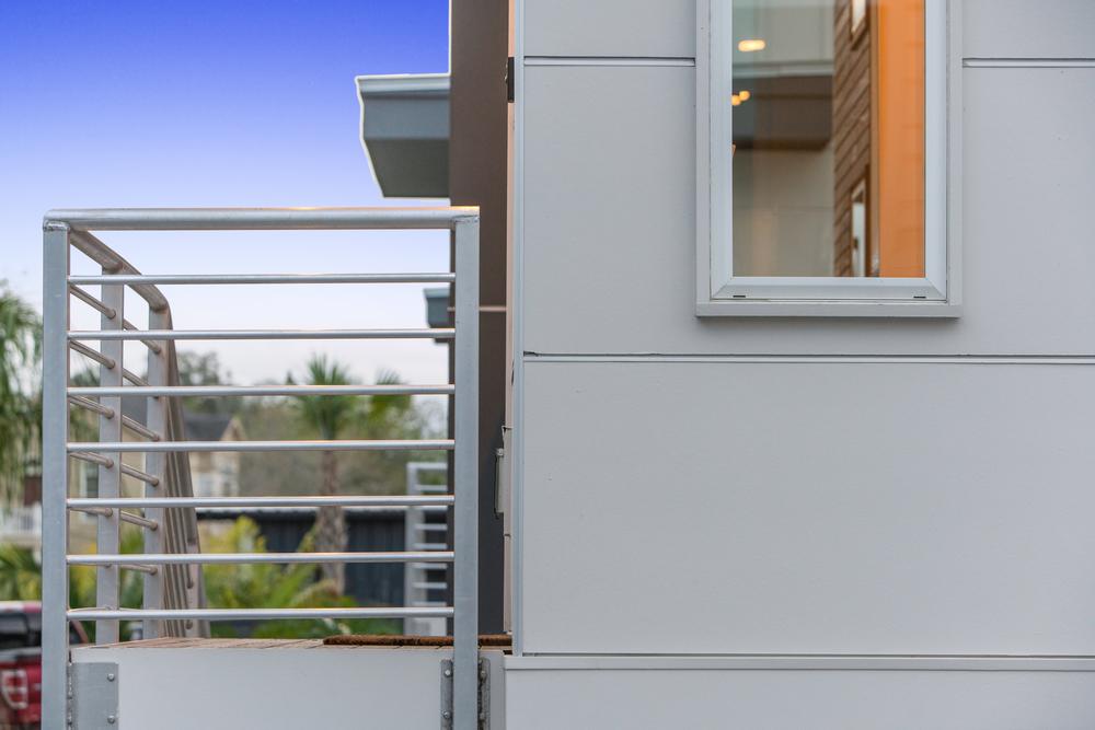 Close-up of gray fiber cement siding on home.