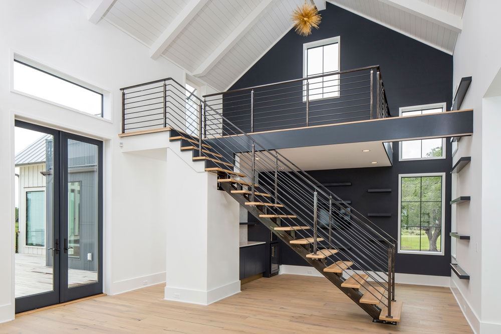 Exterior view of modern residential building with fiber cement panels and large windows
