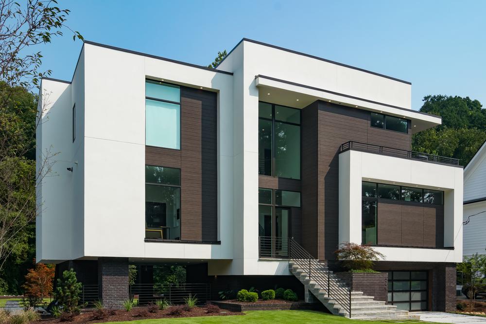 A home in Atlanta Georgia that&rsquo;s white and dark brown with large windows utilizing Nichiha&rsquo;s VintageWood.