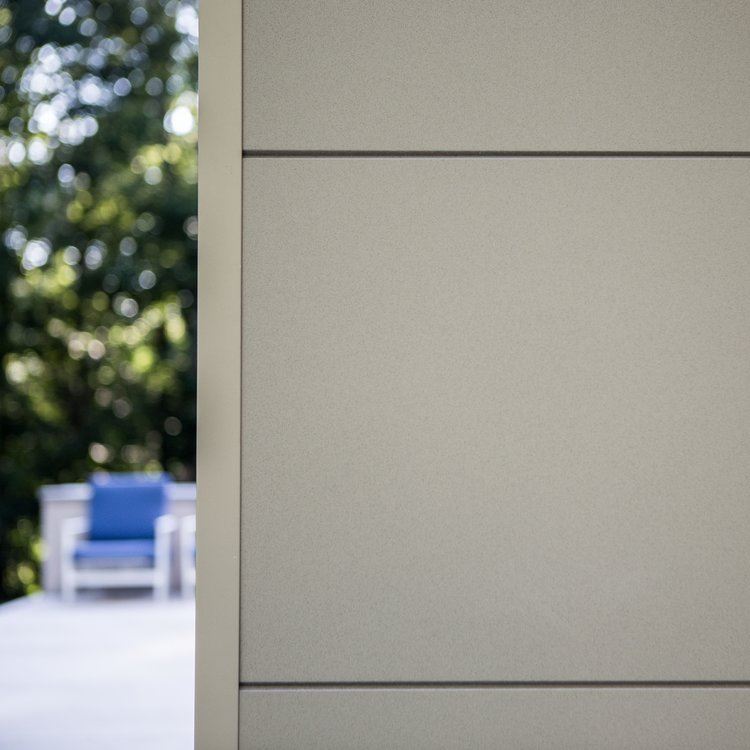 Exterior view of a building featuring Nichiha fiber cement panels and modern design