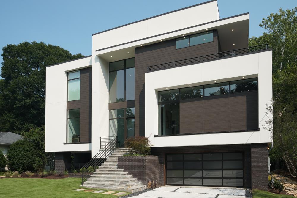 A white and dark brown home with geometric shapes decorated with Nichiha&rsquo;s fiber cement siding.