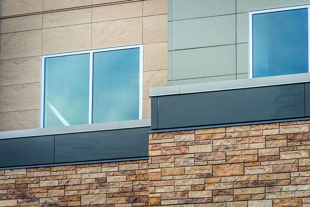 Exterior view of a building featuring Nichiha fiber cement panels and modern design