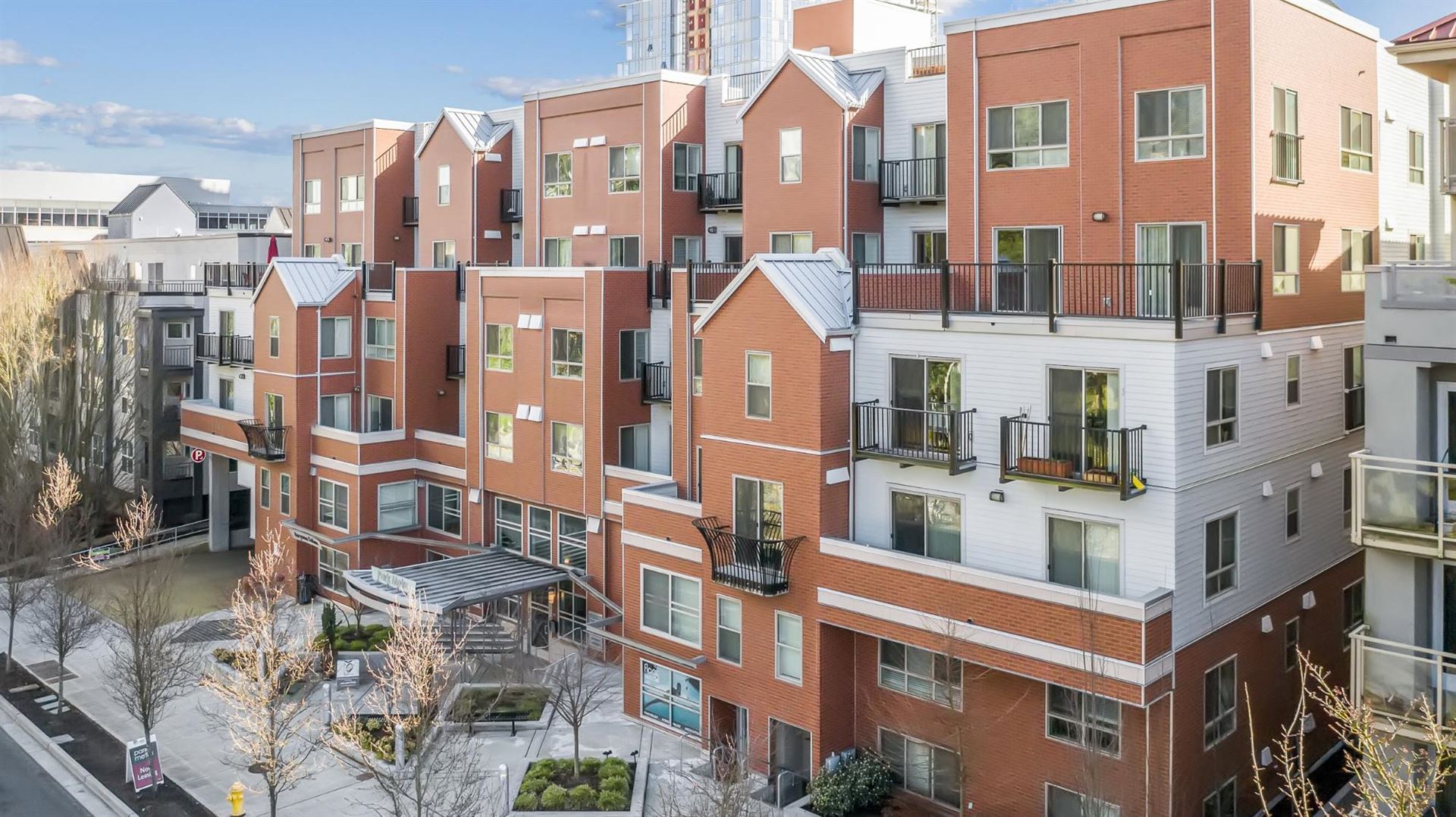 Exterior view of a building featuring Nichiha fiber cement panels and modern design