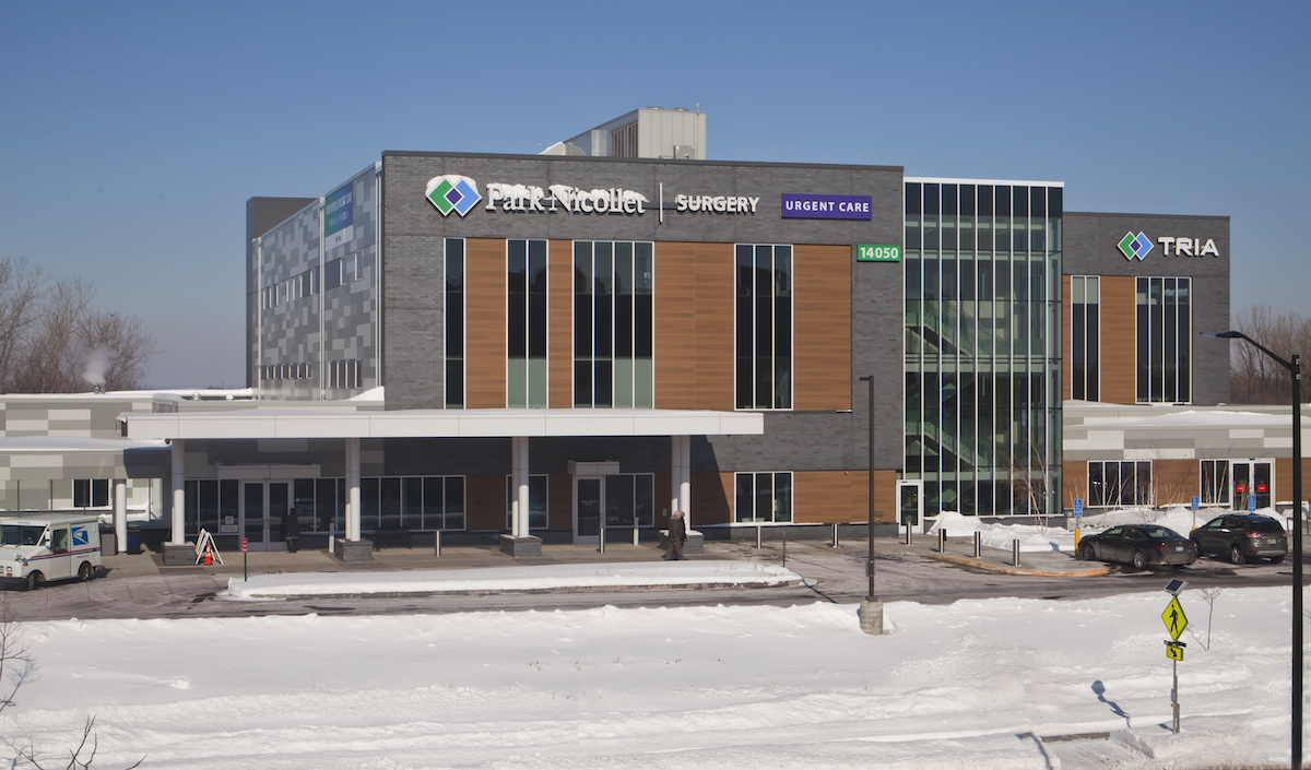 Exterior view of a building featuring Nichiha fiber cement panels and modern design