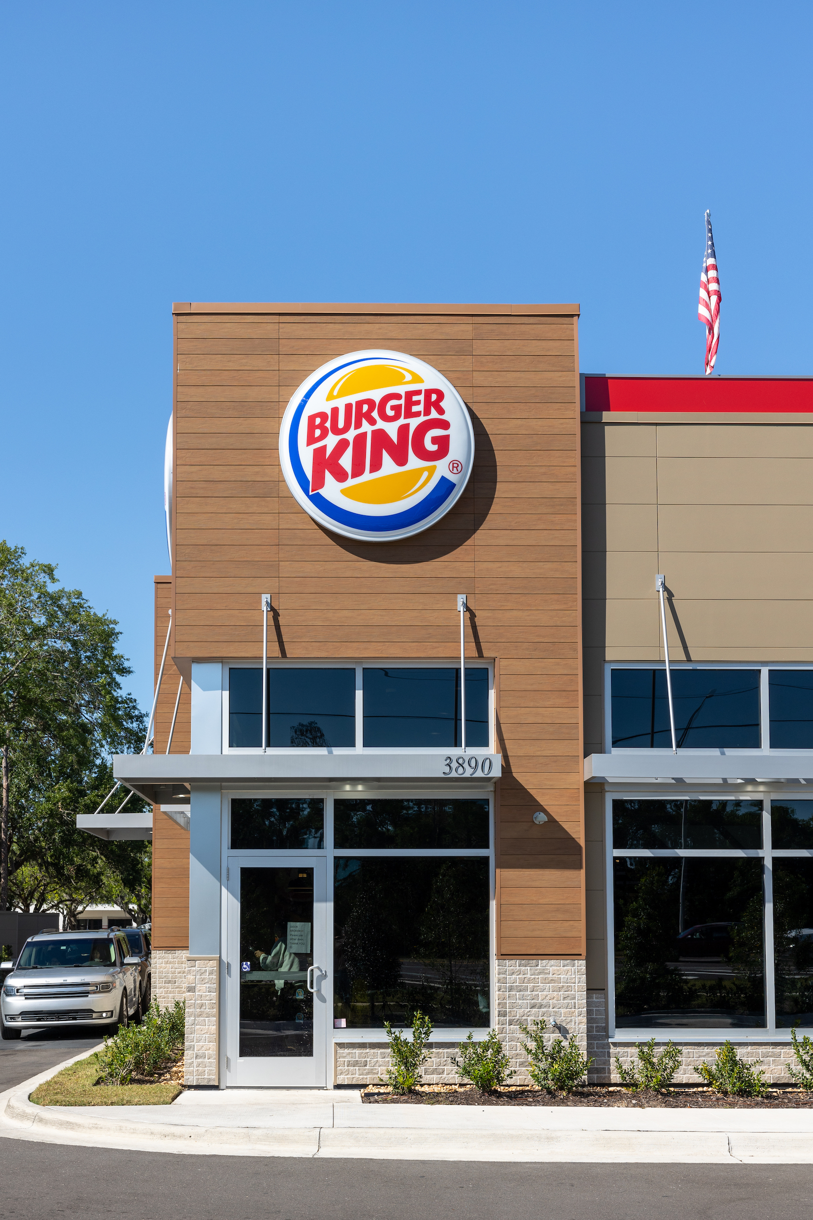 Exterior of fast food restaurant with fiber cement panels and signage