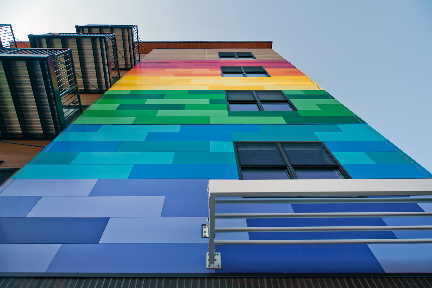 looking up at the rainbow pattern wall of gateway lofts in st. louis missouri