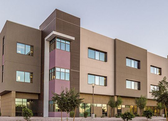 Exterior view of a building featuring Nichiha fiber cement panels and modern design