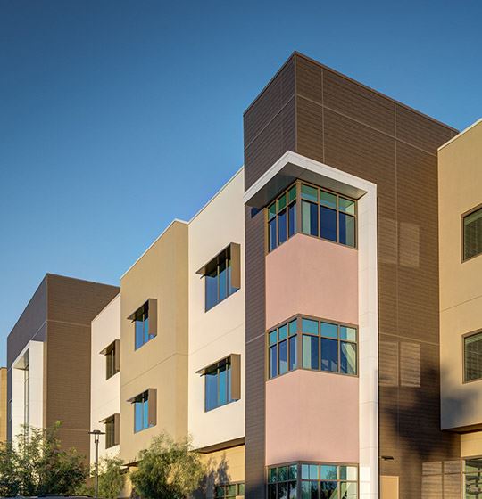 Exterior view of a building featuring Nichiha fiber cement panels and modern design