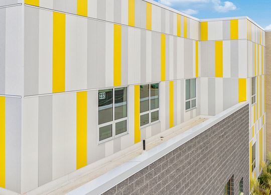 Exterior view of a building featuring Nichiha fiber cement panels and modern design