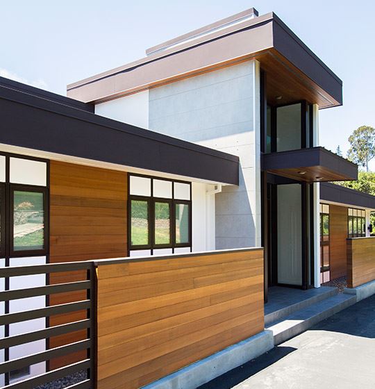 Exterior view of a building featuring Nichiha fiber cement panels and modern design