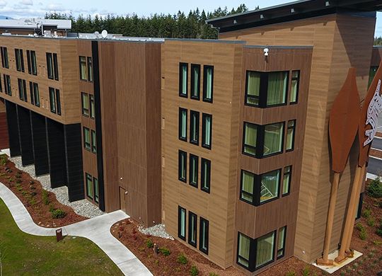 Exterior view of a building featuring Nichiha fiber cement panels and modern design