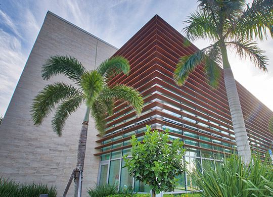 Exterior view of a building featuring Nichiha fiber cement panels and modern design